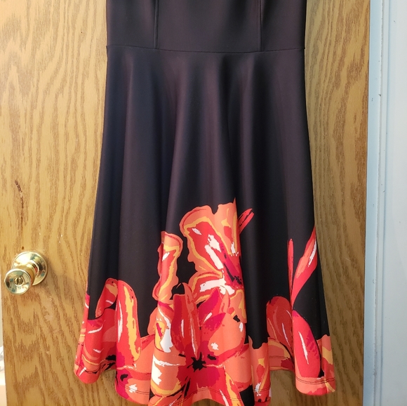 Very pretty black dress with orange/red floral pattern on the bottom. - Picture 2 of 6